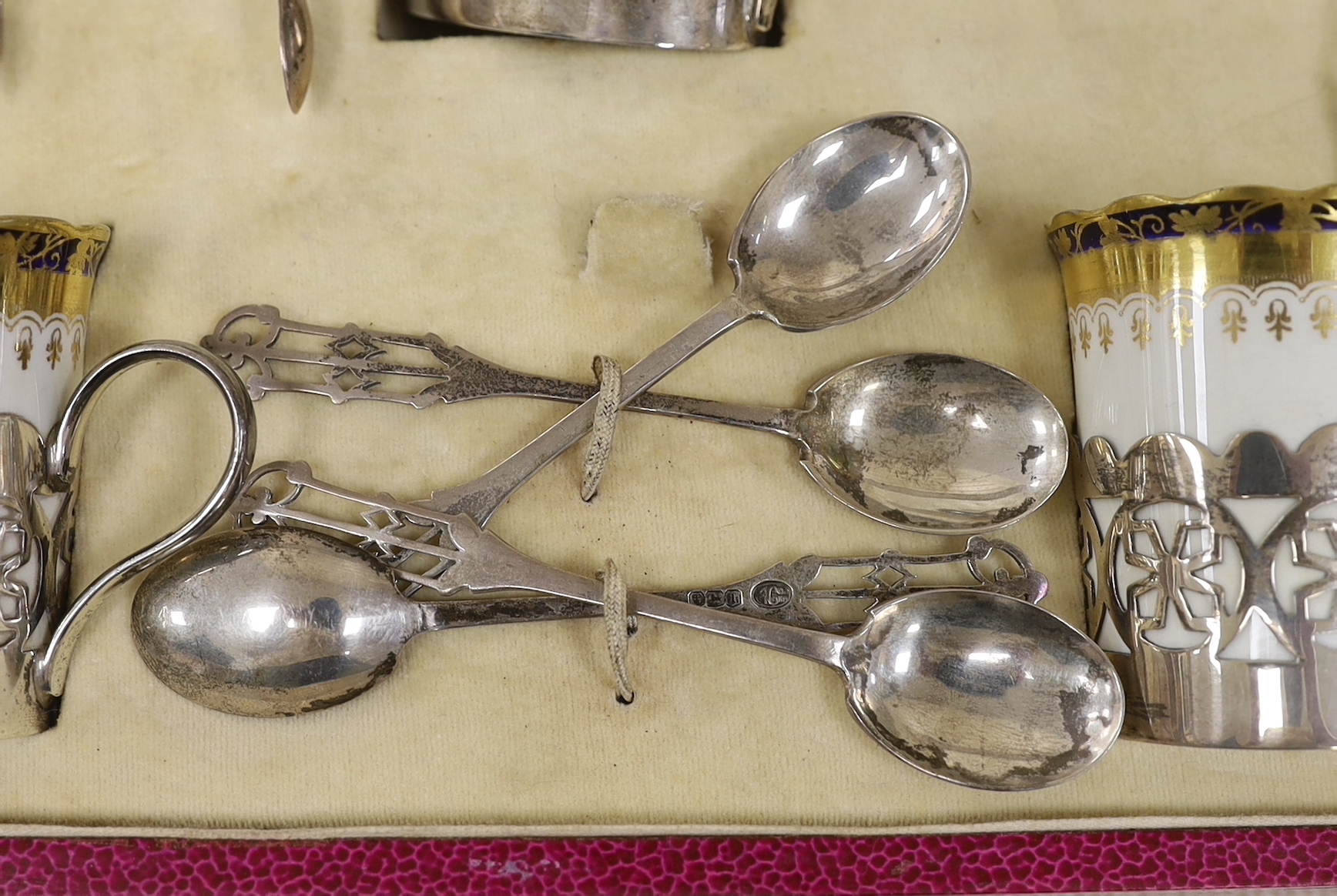 A cased George Jones Crescent China silver mounted coffee set, marks for Alexander Clark Co Ltd Sheffield 1928